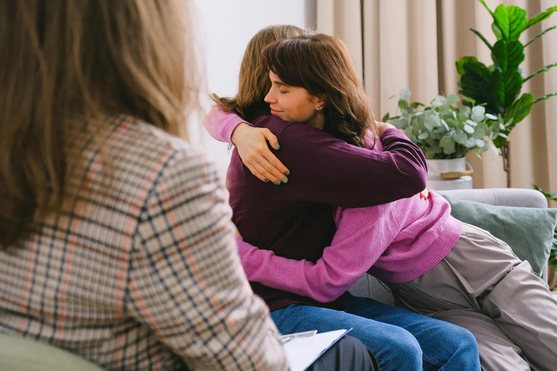 patients hugging in a therapy session