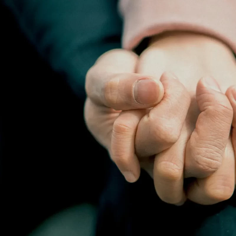 Rehab support in kent with people holding hands.