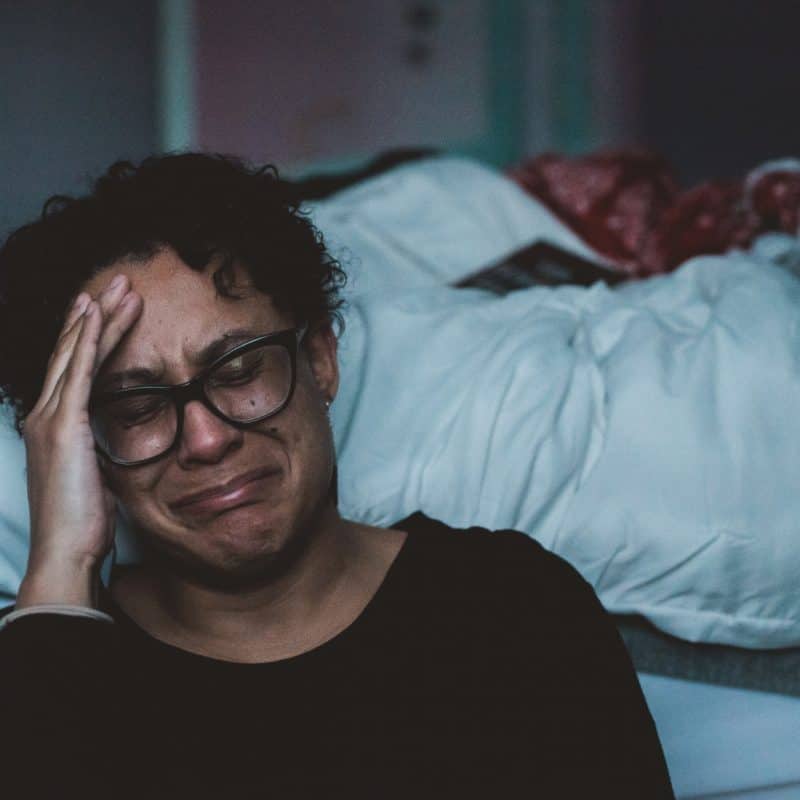 Woman Crying As She's Experiencing Trauma